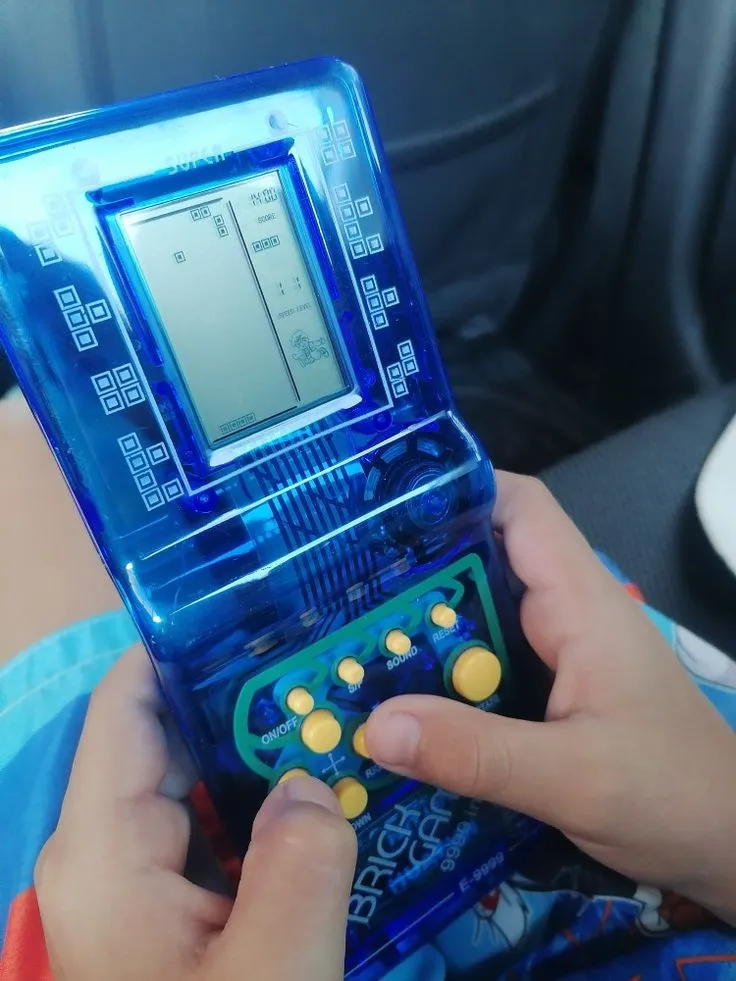 Child Playing Blue Brick Game